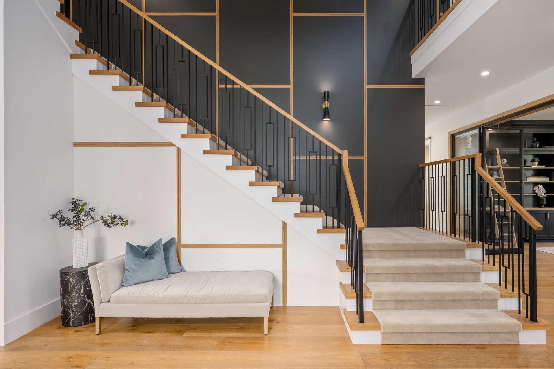 a large modern staircase next to the landing area of a house